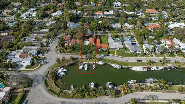bird's eye view with a water view and a residential view