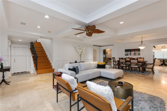 living room with ornamental molding, ceiling fan, stairway, recessed lighting, and coffered ceiling