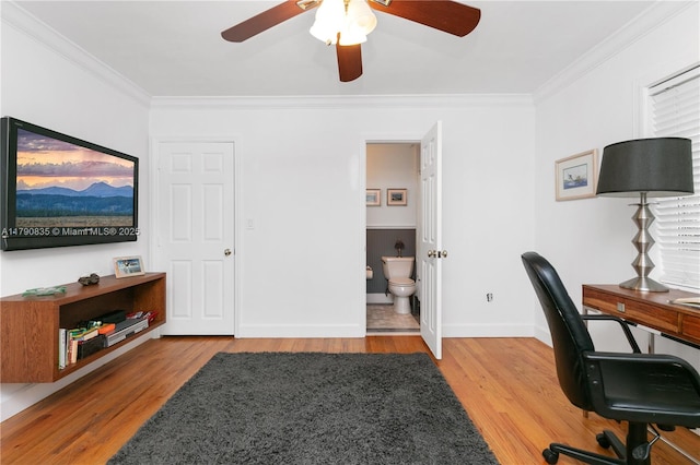 office featuring crown molding, baseboards, ceiling fan, and wood finished floors