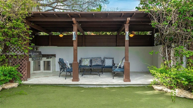 view of patio / terrace with exterior kitchen, a pergola, and a grill