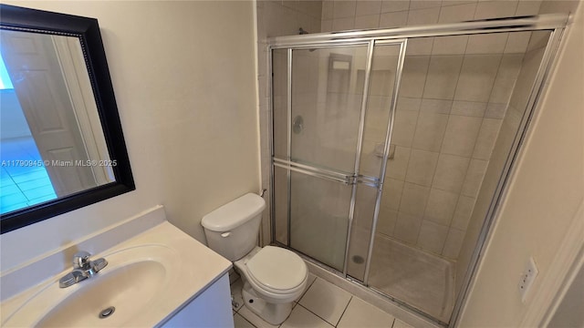 11060 SW 196th St Unit 407, Cutler Bay, FL 33157 - full bathroom with a stall shower, toilet, vanity, and tile patterned flooring