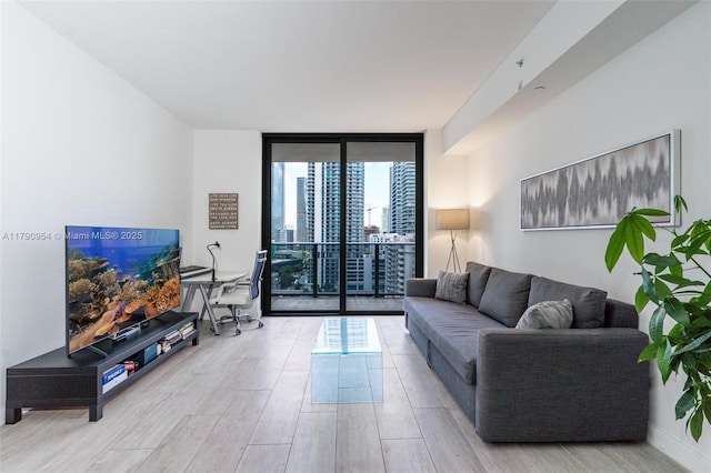 45 SW 9th St Unit 1205, Miami, FL 33130 - living area with a wall of windows and wood finished floors