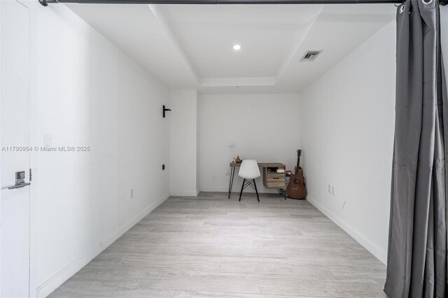 45 SW 9th St Unit 1205, Miami, FL 33130 - spare room featuring light wood-type flooring, a raised ceiling, and recessed lighting