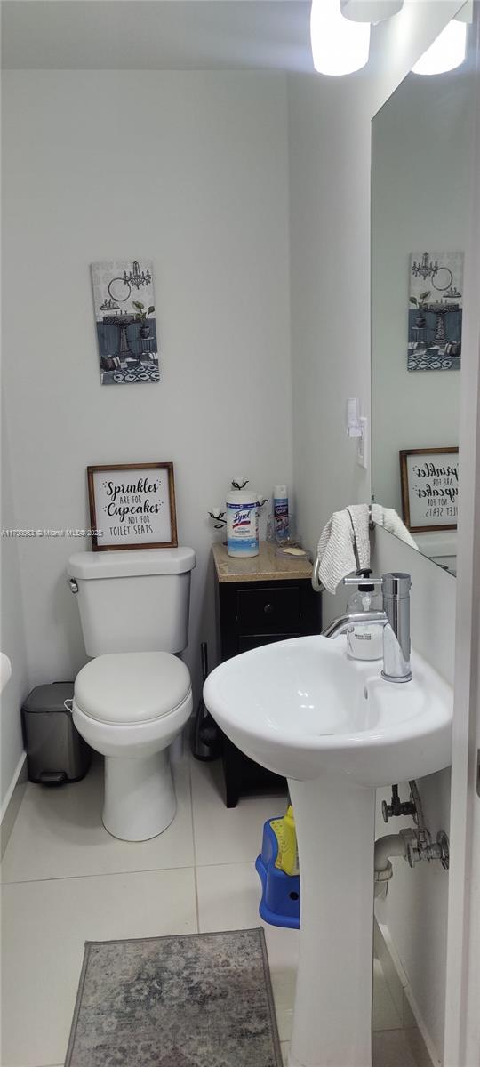 bathroom featuring tile patterned floors and toilet