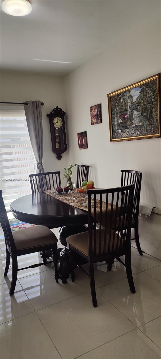 dining room featuring tile patterned flooring