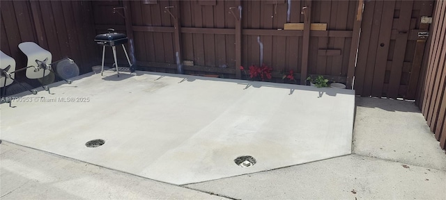 view of patio featuring fence