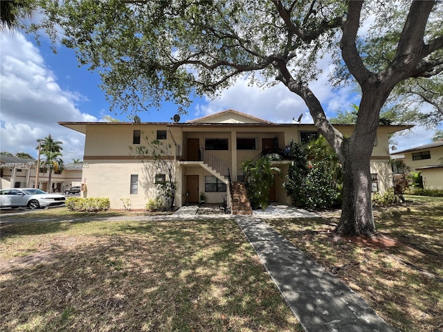 12955 SW 66th Ln Unit 214-2, Miami, FL 33183 - view of front facade featuring stucco siding and stairs