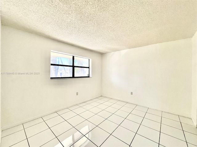 12955 SW 66th Ln Unit 214-2, Miami, FL 33183 - unfurnished room featuring a textured ceiling and light tile patterned floors