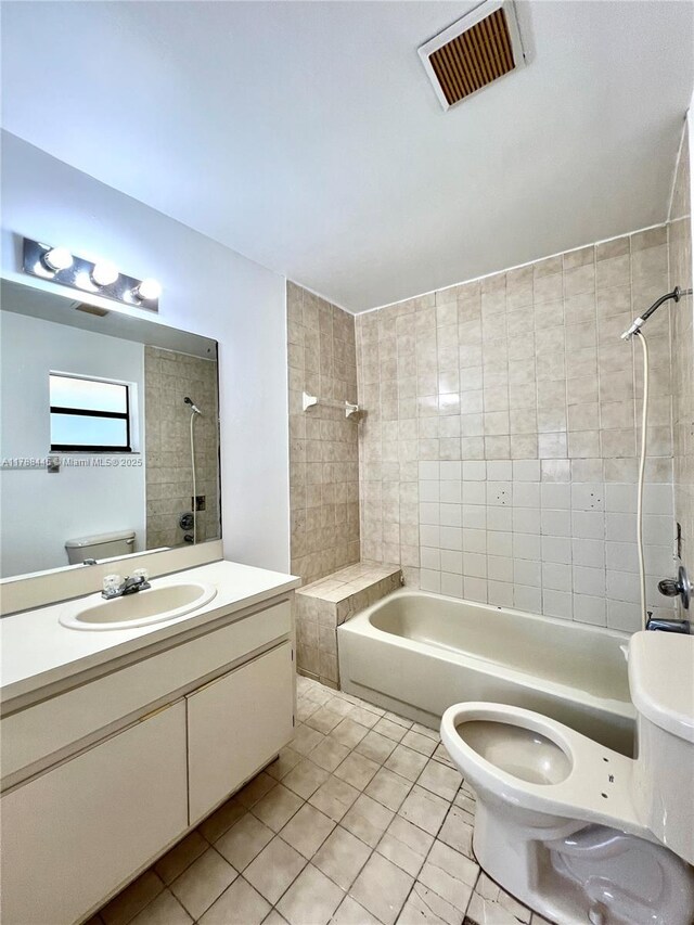 12955 SW 66th Ln Unit 214-2, Miami, FL 33183 - bathroom featuring tile patterned floors, toilet, vanity, and washtub / shower combination