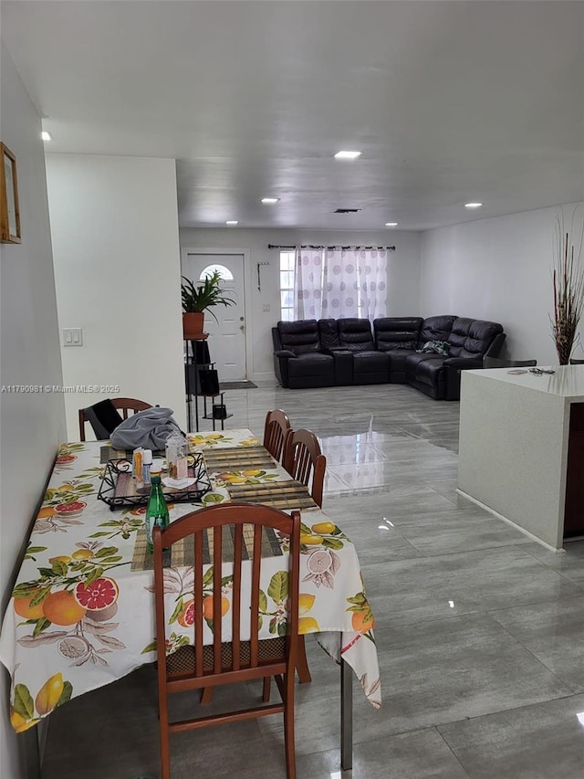 dining space featuring recessed lighting