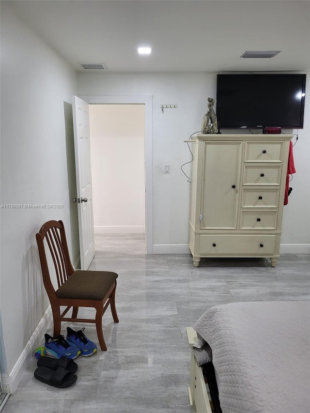 bedroom with visible vents and baseboards