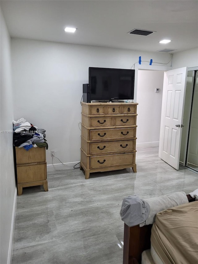 bedroom with visible vents and baseboards