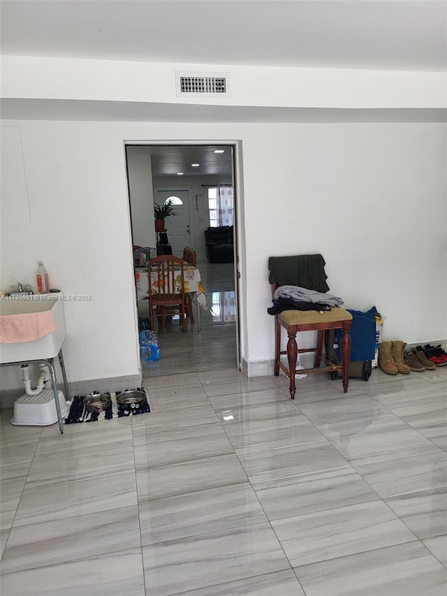 interior space featuring tile patterned floors and visible vents