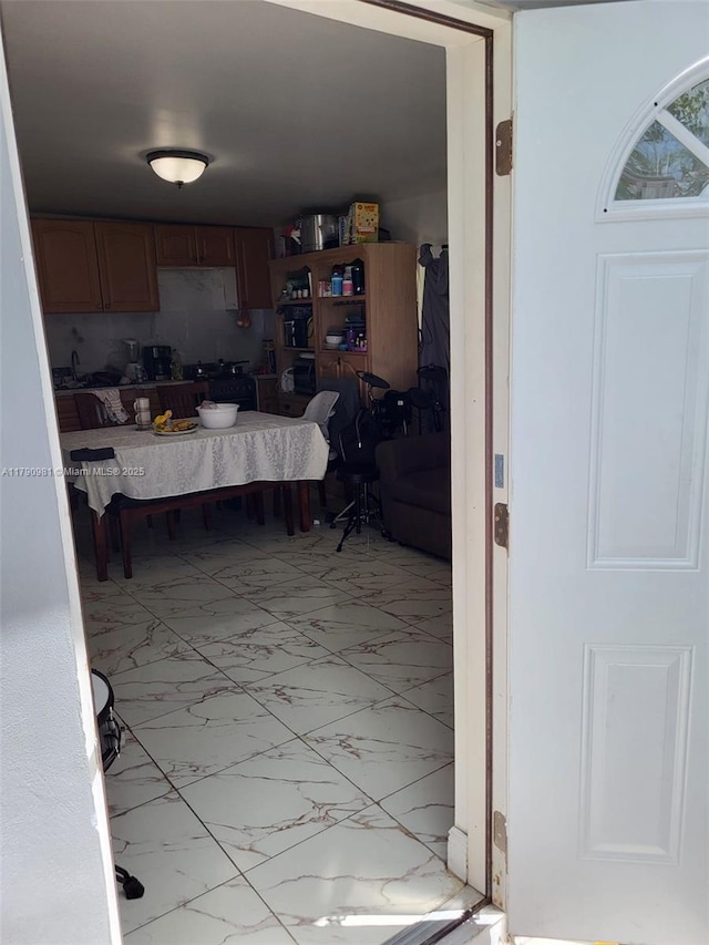 kitchen featuring marble finish floor