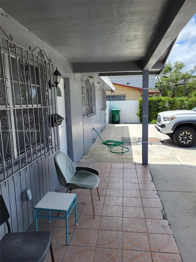 view of patio / terrace featuring fence