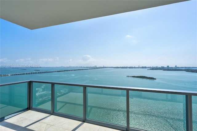 balcony featuring a water view