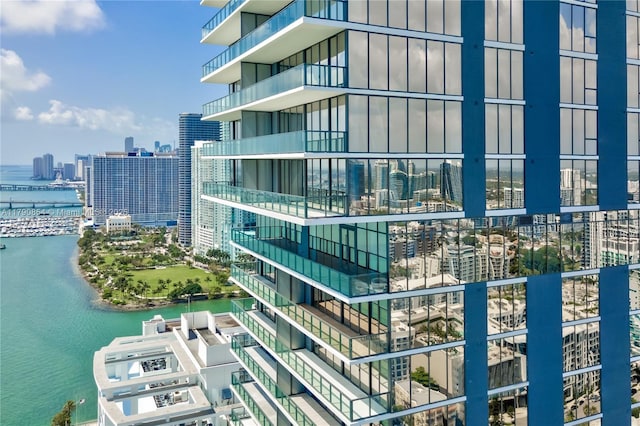 view of property with a view of city and a water view