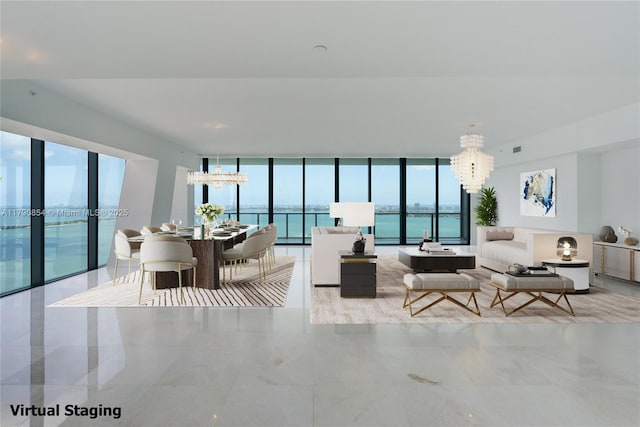 living area featuring french doors, a wall of windows, a chandelier, and plenty of natural light
