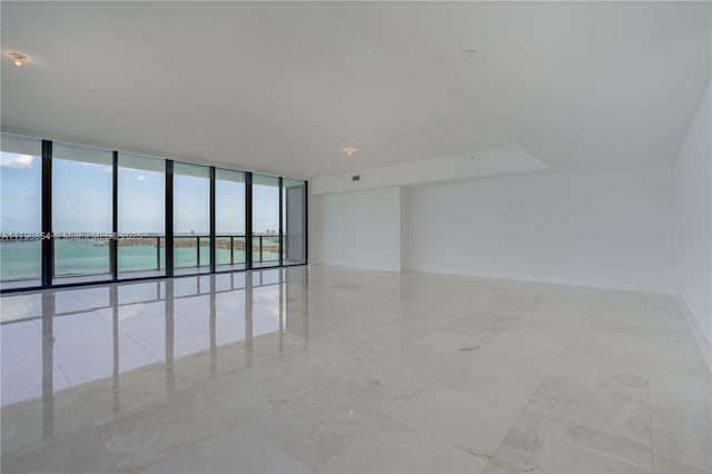 spare room featuring expansive windows