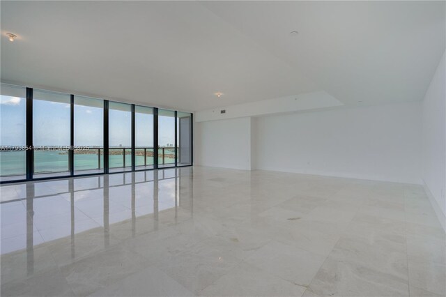 788 NE 23rd St Unit 3102, Miami, FL 33137 - empty room featuring a wall of windows