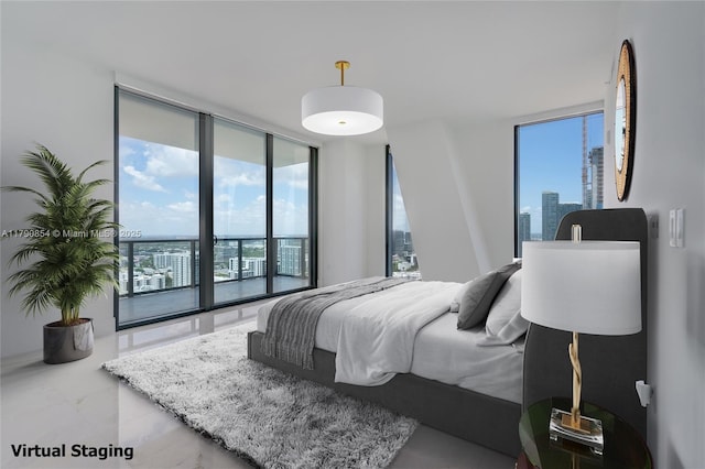 bedroom with floor to ceiling windows, a city view, and access to outside