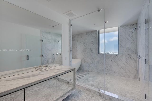 full bath with visible vents, vanity, marble finish floor, and a marble finish shower