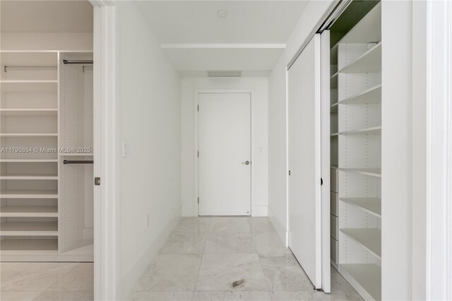 788 NE 23rd St Unit 3102, Miami, FL 33137 - hallway featuring baseboards and marble finish flooring