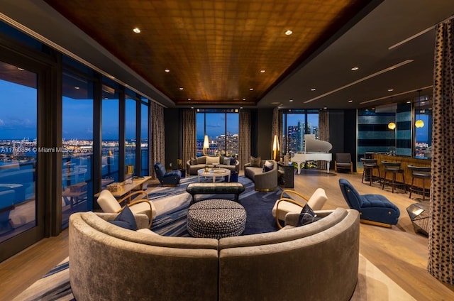 home theater room with wood ceiling, wood finished floors, and recessed lighting