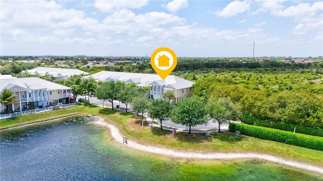 drone / aerial view with a residential view and a water view