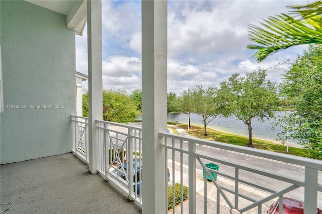 balcony featuring a water view