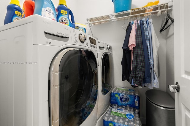 clothes washing area featuring washer and dryer and laundry area