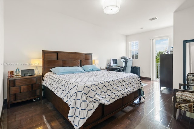 bedroom featuring visible vents, baseboards, access to outside, and dark wood finished floors