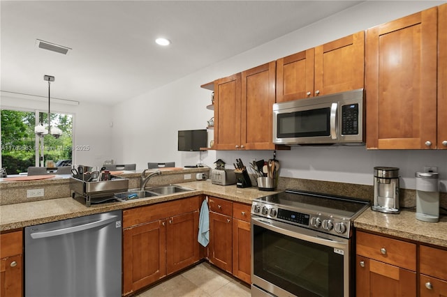 kitchen with open shelves, a sink, visible vents, stainless steel appliances, and brown cabinetry