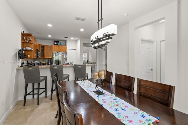 dining area with baseboards, visible vents, and recessed lighting