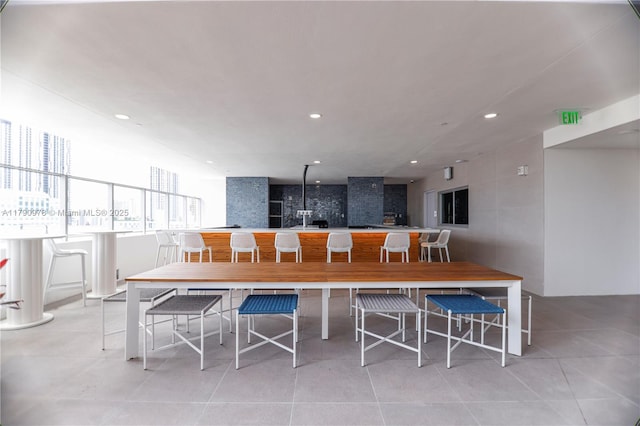 dining area featuring light tile patterned floors and recessed lighting
