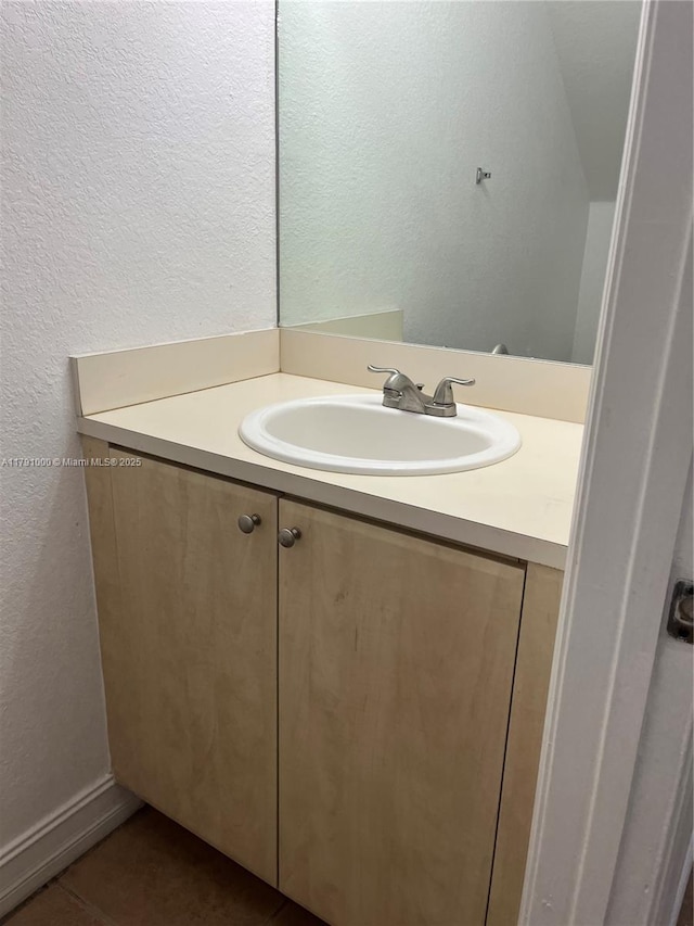 7985 NW 8th St Unit 110A, Miami, FL 33126 - bathroom with a textured wall, vanity, and tile patterned floors