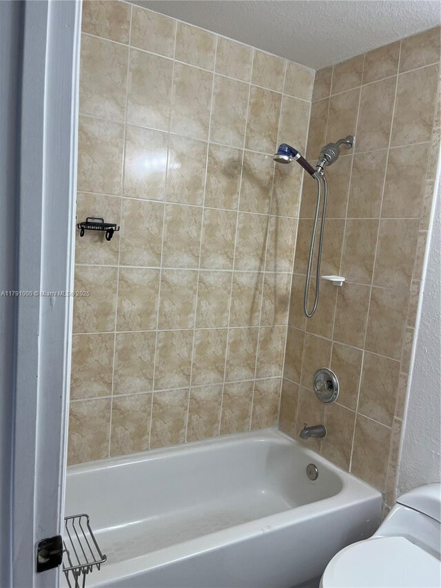 7985 NW 8th St Unit 110A, Miami, FL 33126 - bathroom with toilet, a textured ceiling, and  shower combination