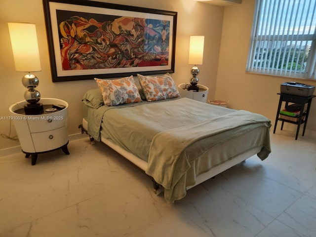 bedroom featuring baseboards