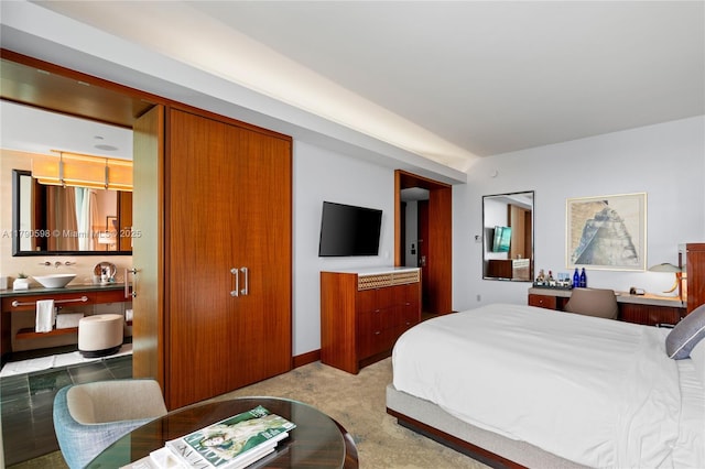 10295 Collins Ave Unit 312, Bal Harbour, FL 33154 - bedroom featuring connected bathroom and a sink