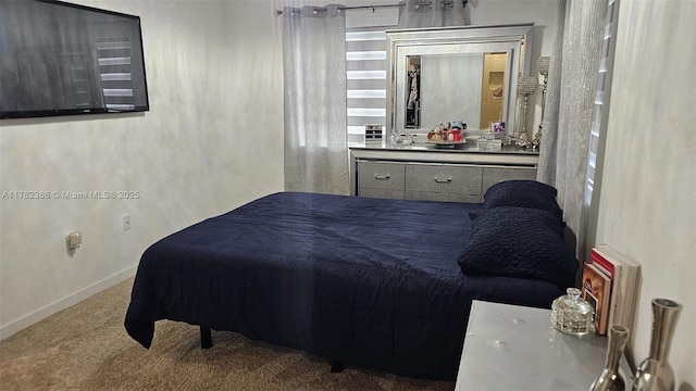 bedroom with carpet floors and baseboards