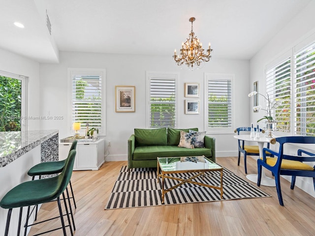 3025 SW 13th St, Miami, FL 33145 - living area with light wood-style floors, a chandelier, baseboards, and recessed lighting