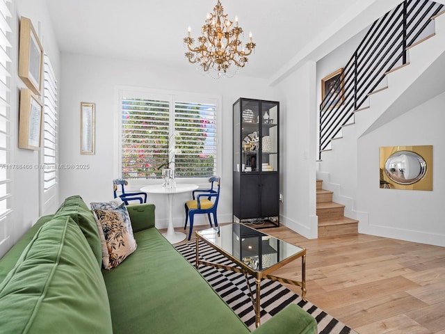 3025 SW 13th St, Miami, FL 33145 - entrance foyer featuring stairway, light wood-style flooring, a chandelier, and plenty of natural light