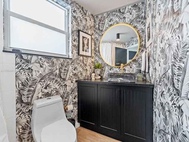 3025 SW 13th St, Miami, FL 33145 - bathroom featuring wallpapered walls, vanity, wood finished floors, and toilet