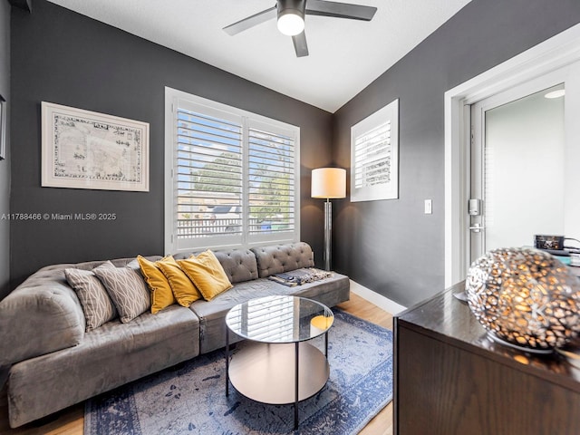 3025 SW 13th St, Miami, FL 33145 - living room with light wood-style flooring, ceiling fan, and baseboards