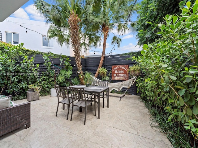 3025 SW 13th St, Miami, FL 33145 - fenced backyard featuring outdoor dining space and a patio