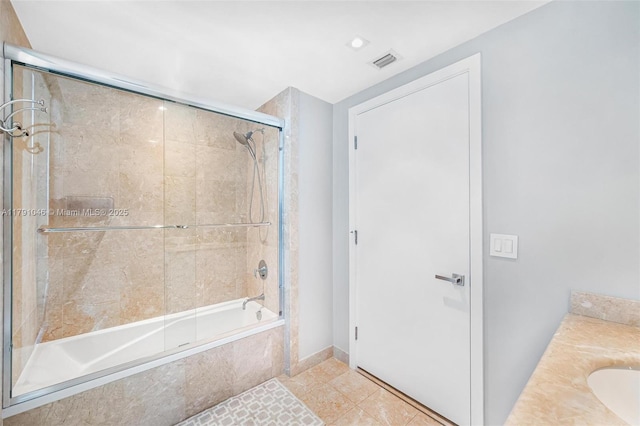 full bathroom with visible vents, tile patterned flooring, and tiled shower / bath combo