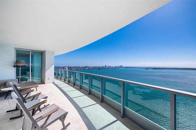 balcony featuring a water view
