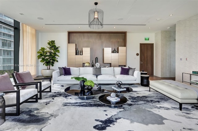 living area featuring floor to ceiling windows