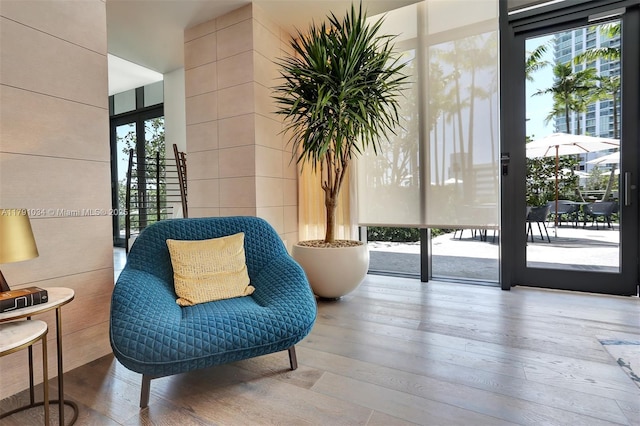 sitting room with hardwood / wood-style floors