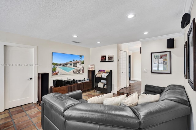 living area featuring visible vents, a textured ceiling, and recessed lighting
